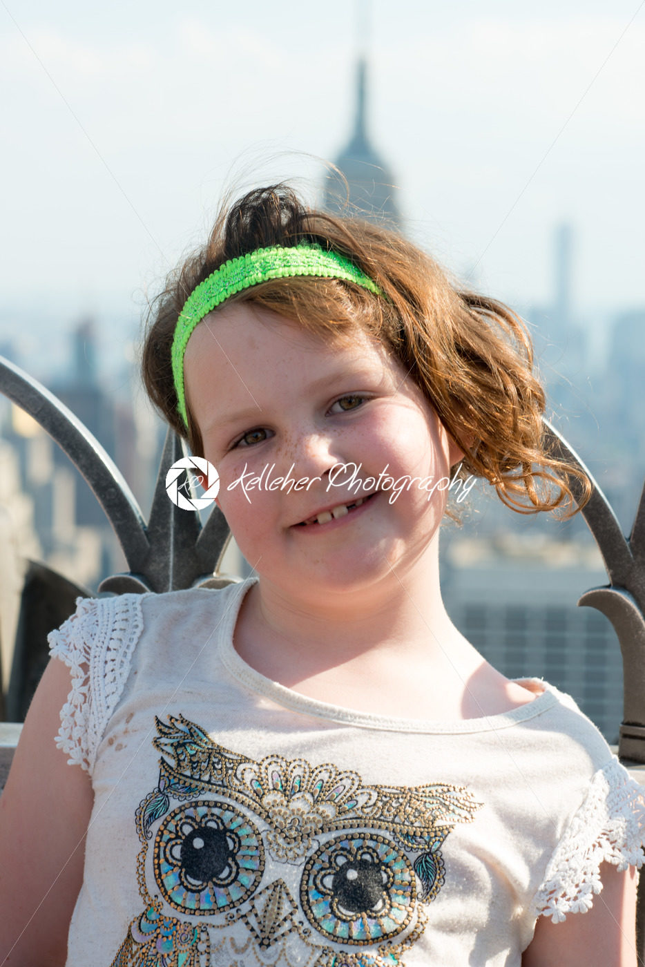 Beautiful young girl on observation deck overlooking the lower Manhattan New York City skyline - Kelleher Photography Store