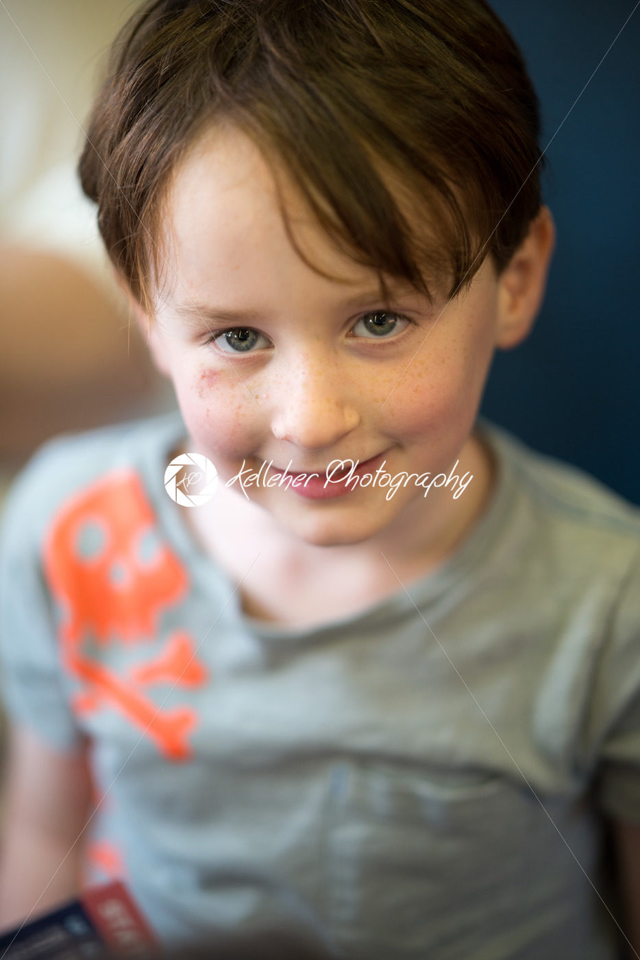 Close Portrait of Boy Smiling Sitting Down - Kelleher Photography Store