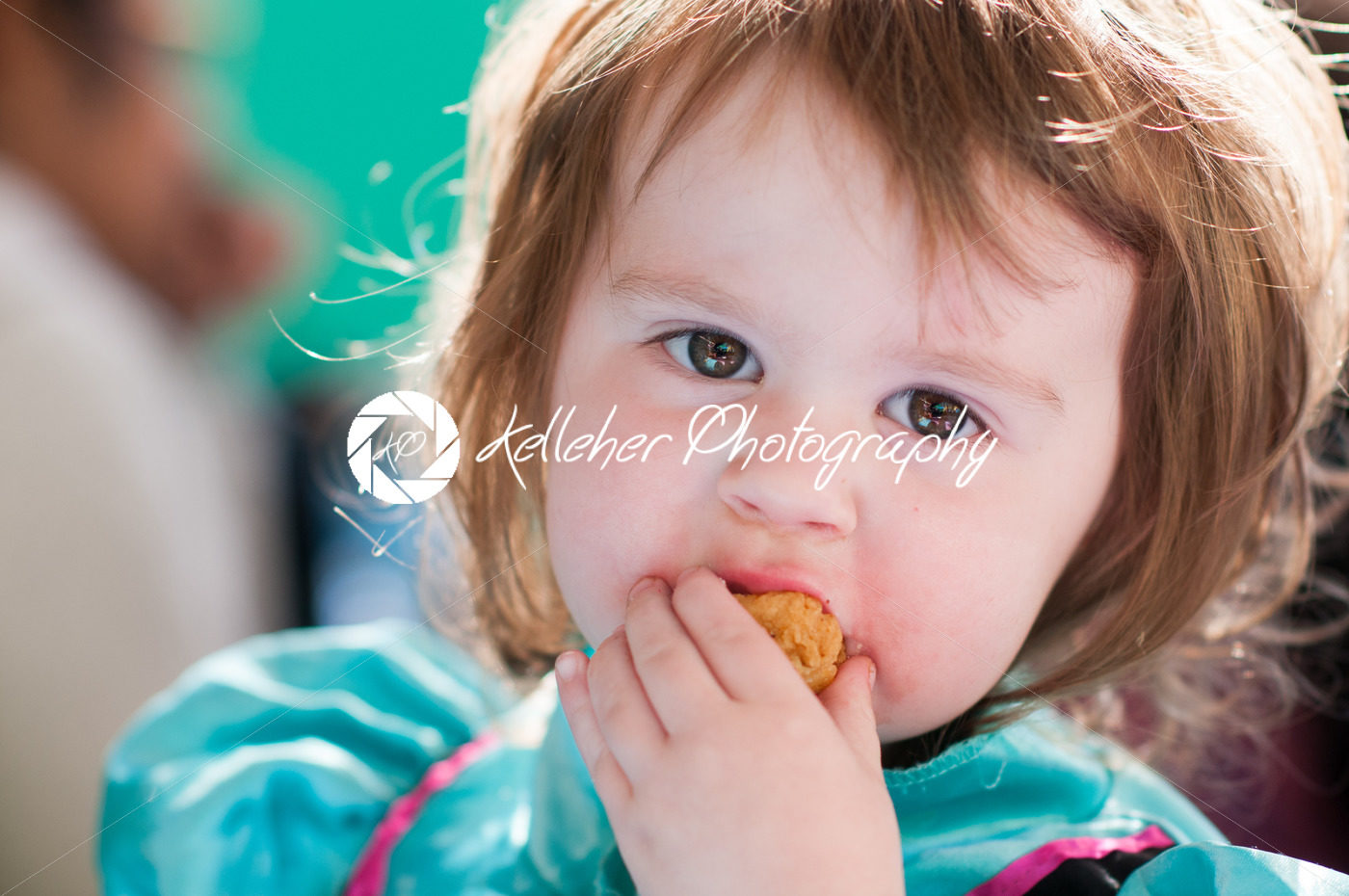 Close up Portrait of young girl eating - Kelleher Photography Store