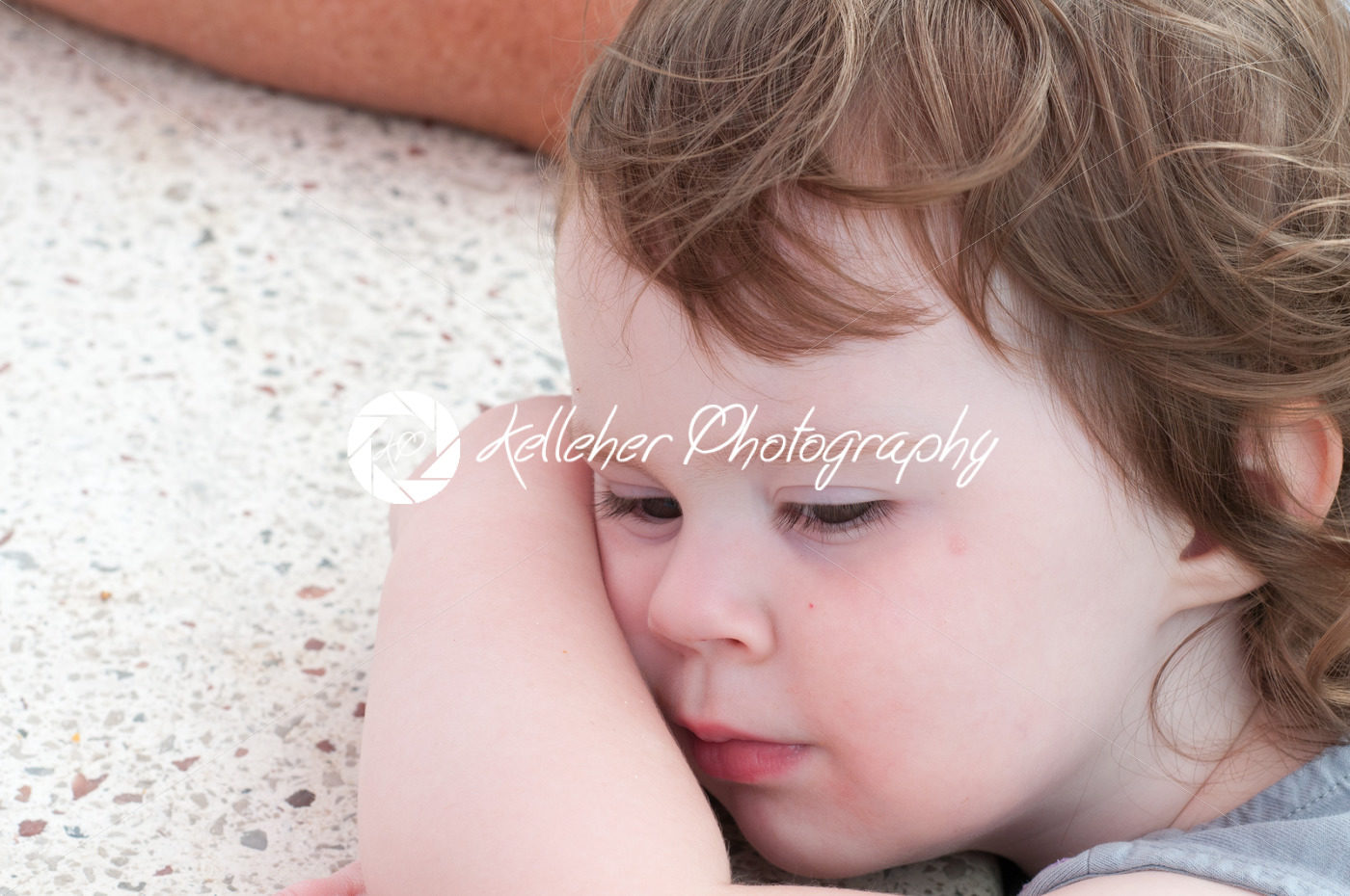 Cute young toddler girl falling asleep resting her head on table - Kelleher Photography Store