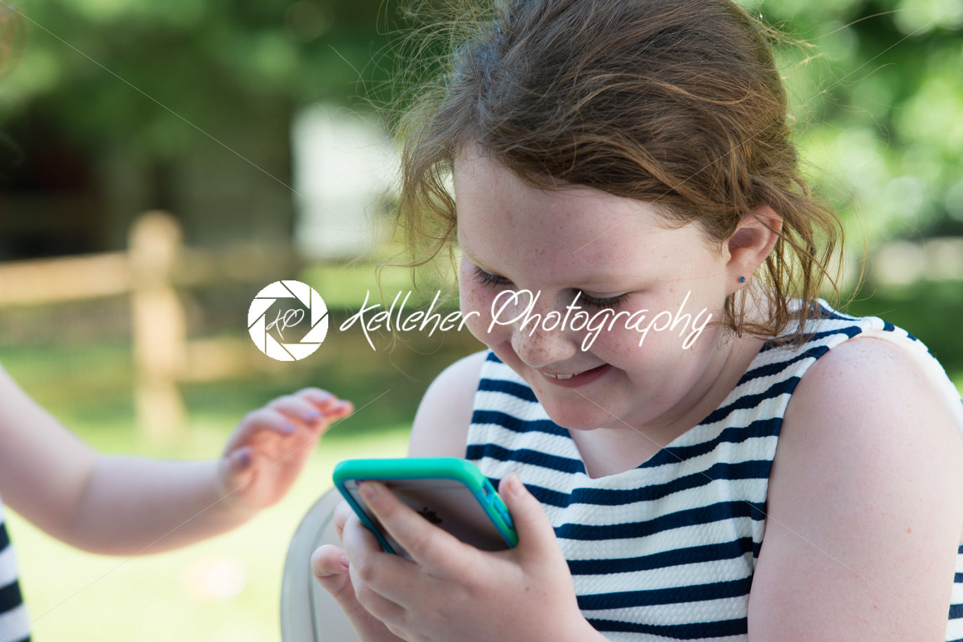 Happy Laughing Children Playing with Smartphone Outside - Kelleher Photography Store