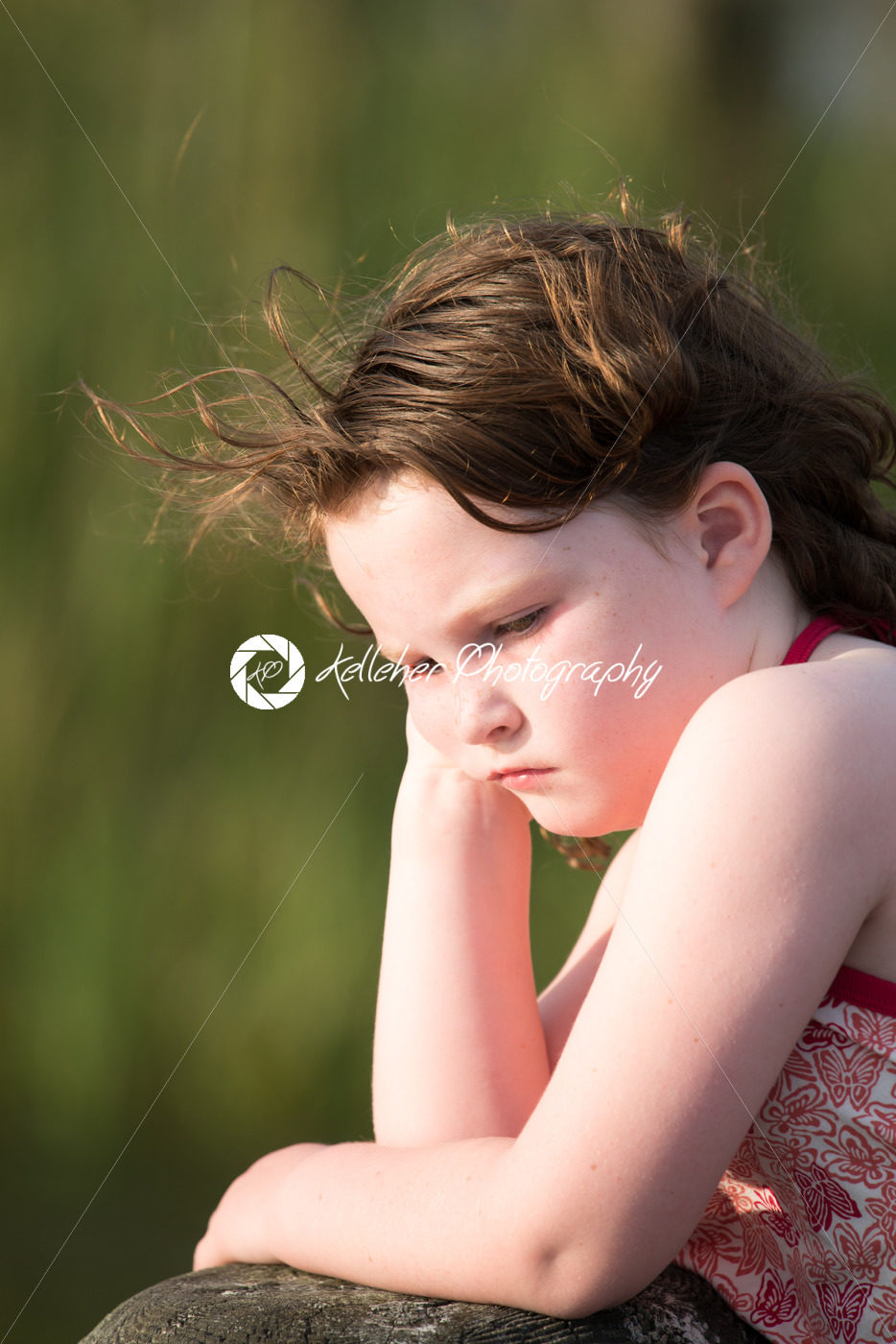 Portrait of beautiful attractive young girl thinking outside at sunset - Kelleher Photography Store