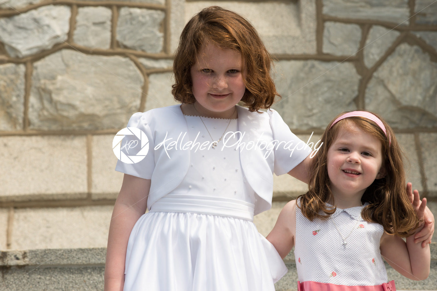 VILLANOVA, PA – MAY 14: Young Girl dressed up receiving her First Holy Communion at St. Thomas of Villanova Church - Kelleher Photography Store