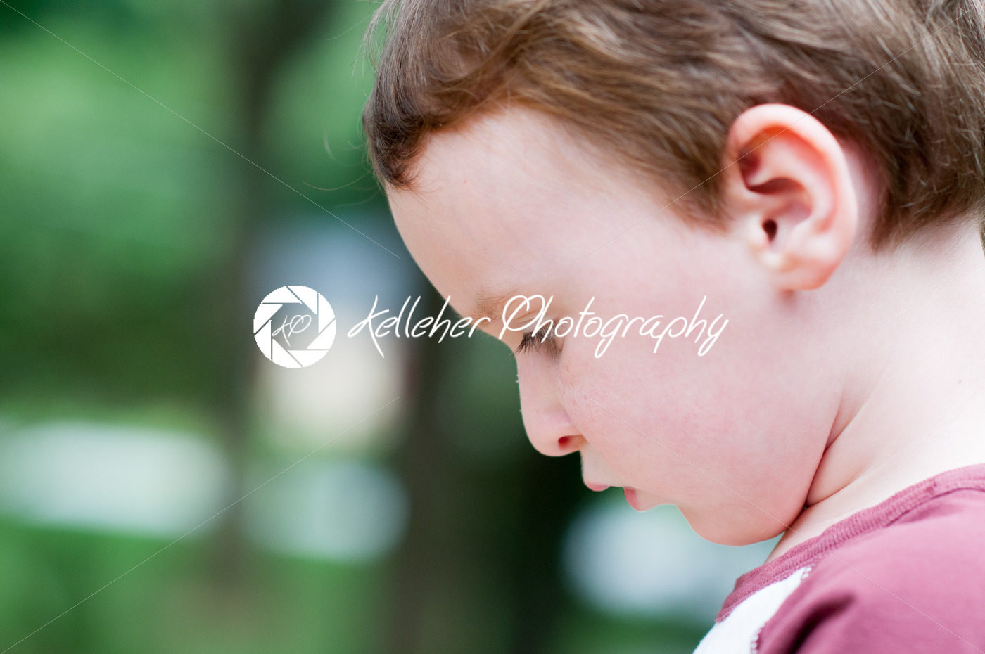 Young boy playing outside in back yard - Kelleher Photography Store