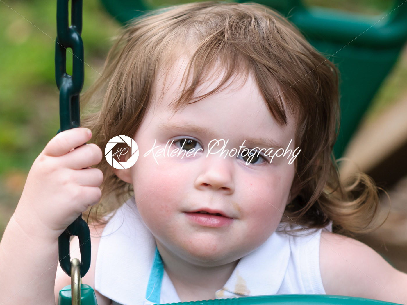 Young girl having fun on a swing - Kelleher Photography Store