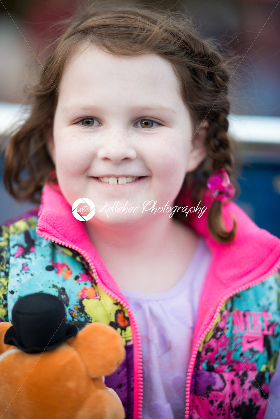 Young girl outside on boat looking happy - Kelleher Photography Store