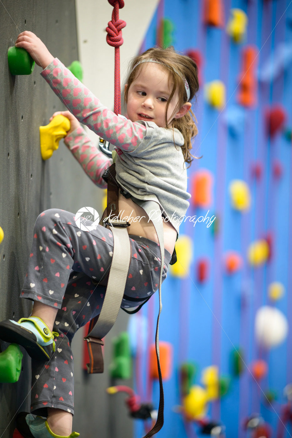 little girl climbing a rock wall indoor - Kelleher Photography Store