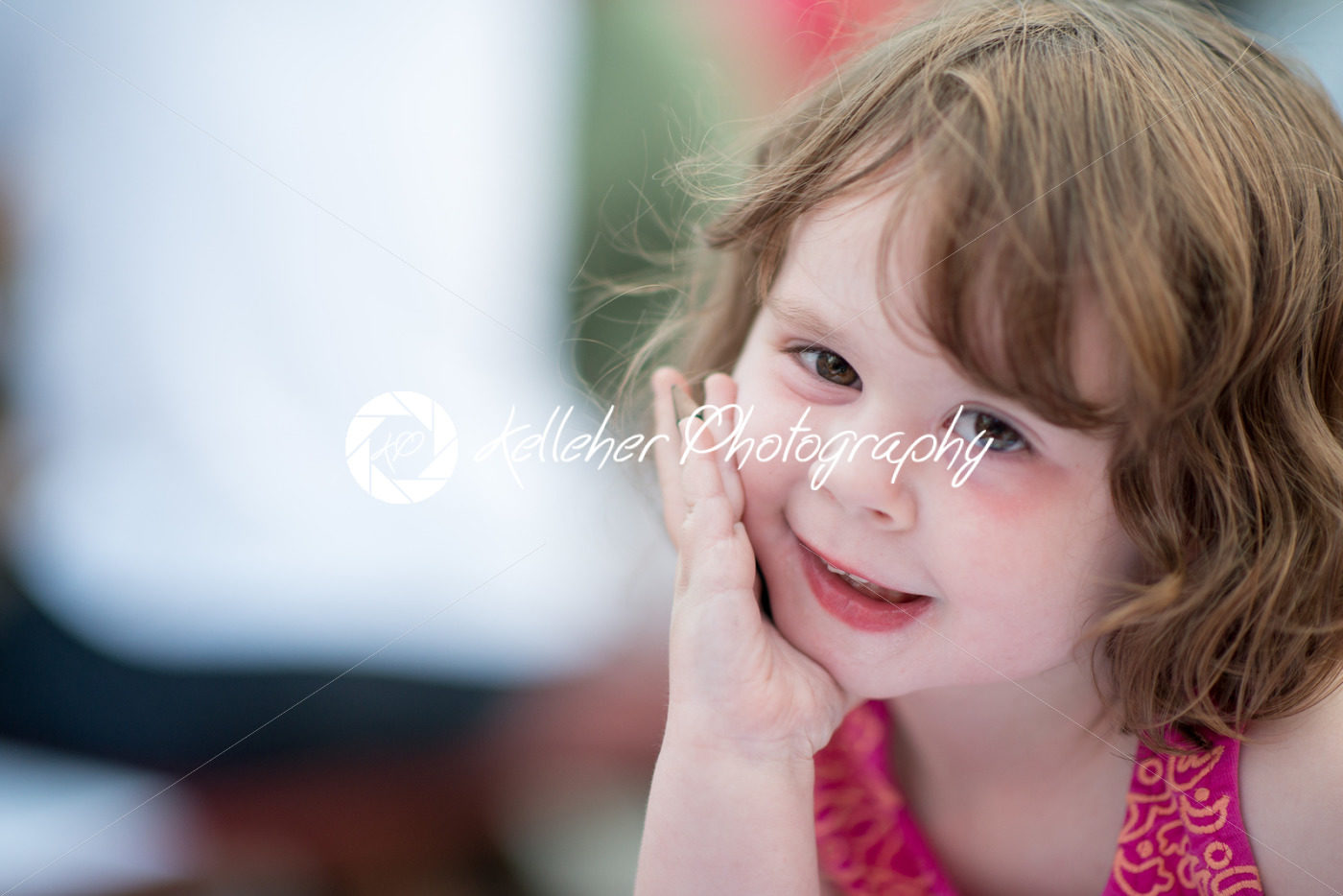 young little girl sitting down and looking happy - Kelleher Photography Store