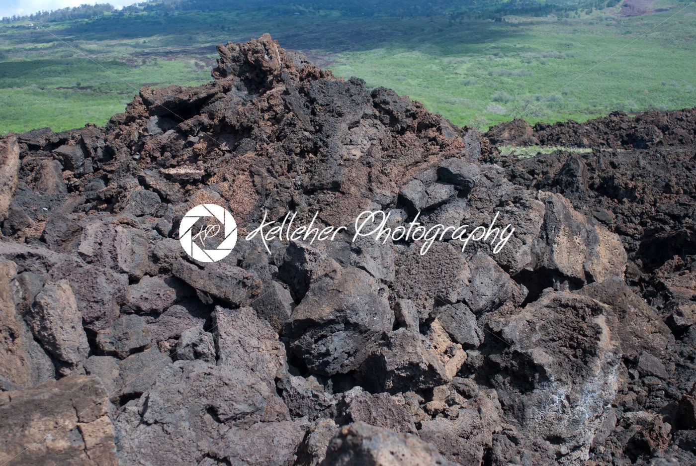 Black lava rocks line the shore at Keanae on the road to Hana in Maui, Hawaii - Kelleher Photography Store