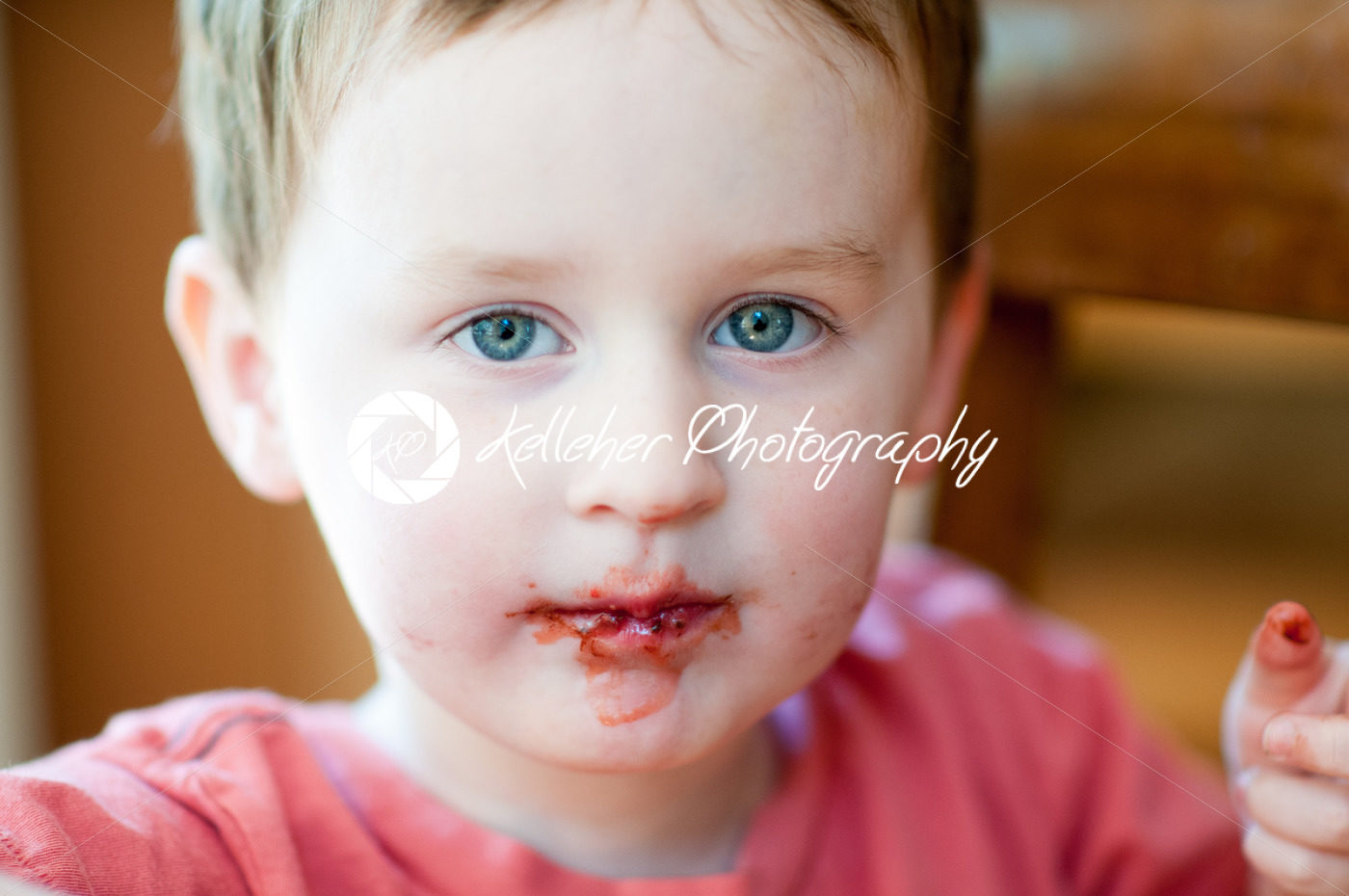 Little boy eating chocolate covered strawberries - Kelleher Photography Store