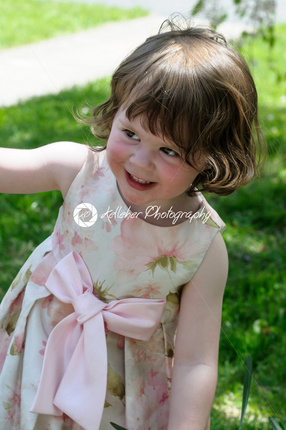 Portrait of a cute little girl smiling outside - Kelleher Photography Store