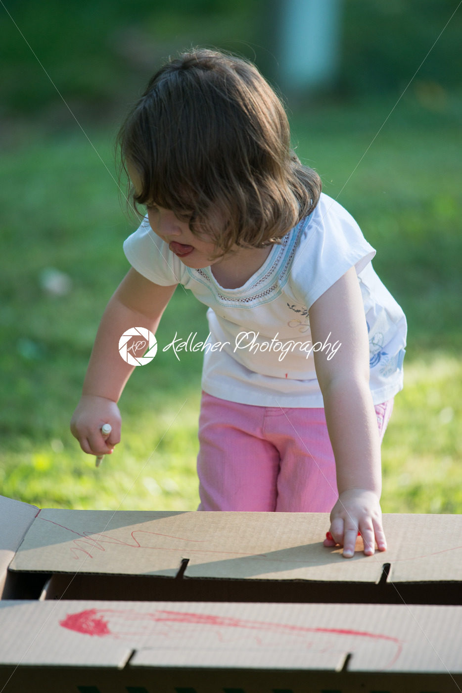 Young girl outside coloring with markers - Kelleher Photography Store