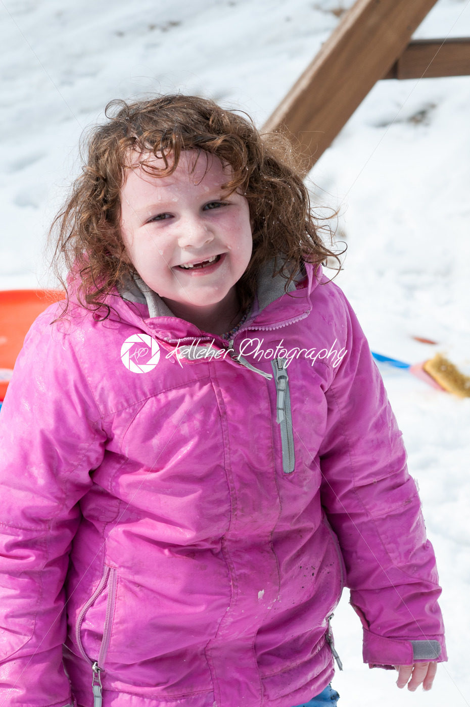 Happy toddler girl in warm coat on on snow day and having a fun in the winter outside, outdoor portrait - Kelleher Photography Store