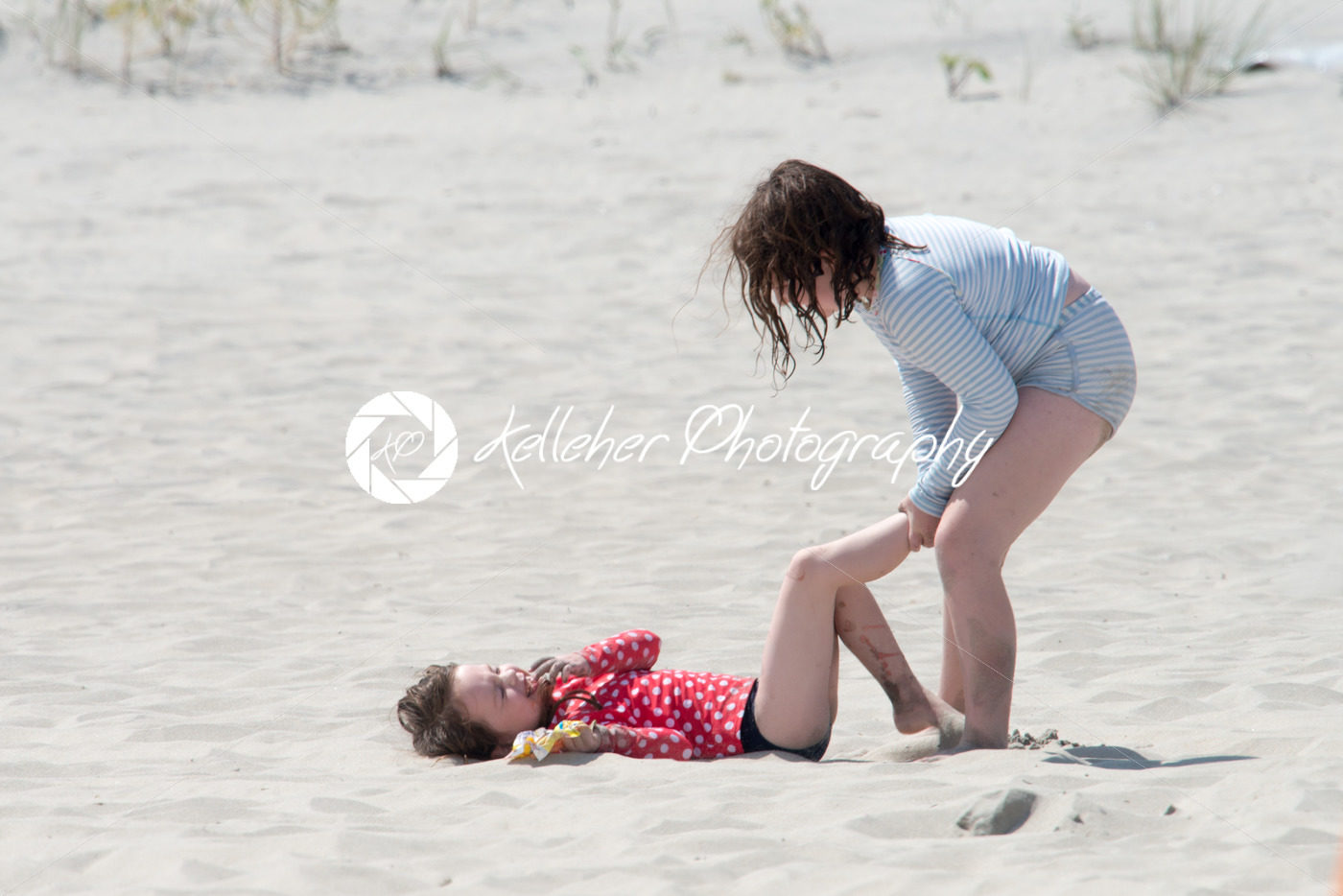 Sibling girls playing in the sand on summer beach - Kelleher Photography Store