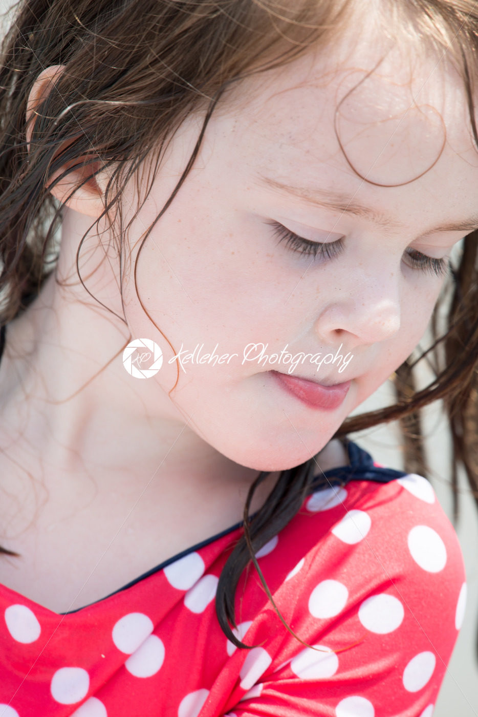 yound toddler girl having fun digging in the sand at the beach - Kelleher Photography Store