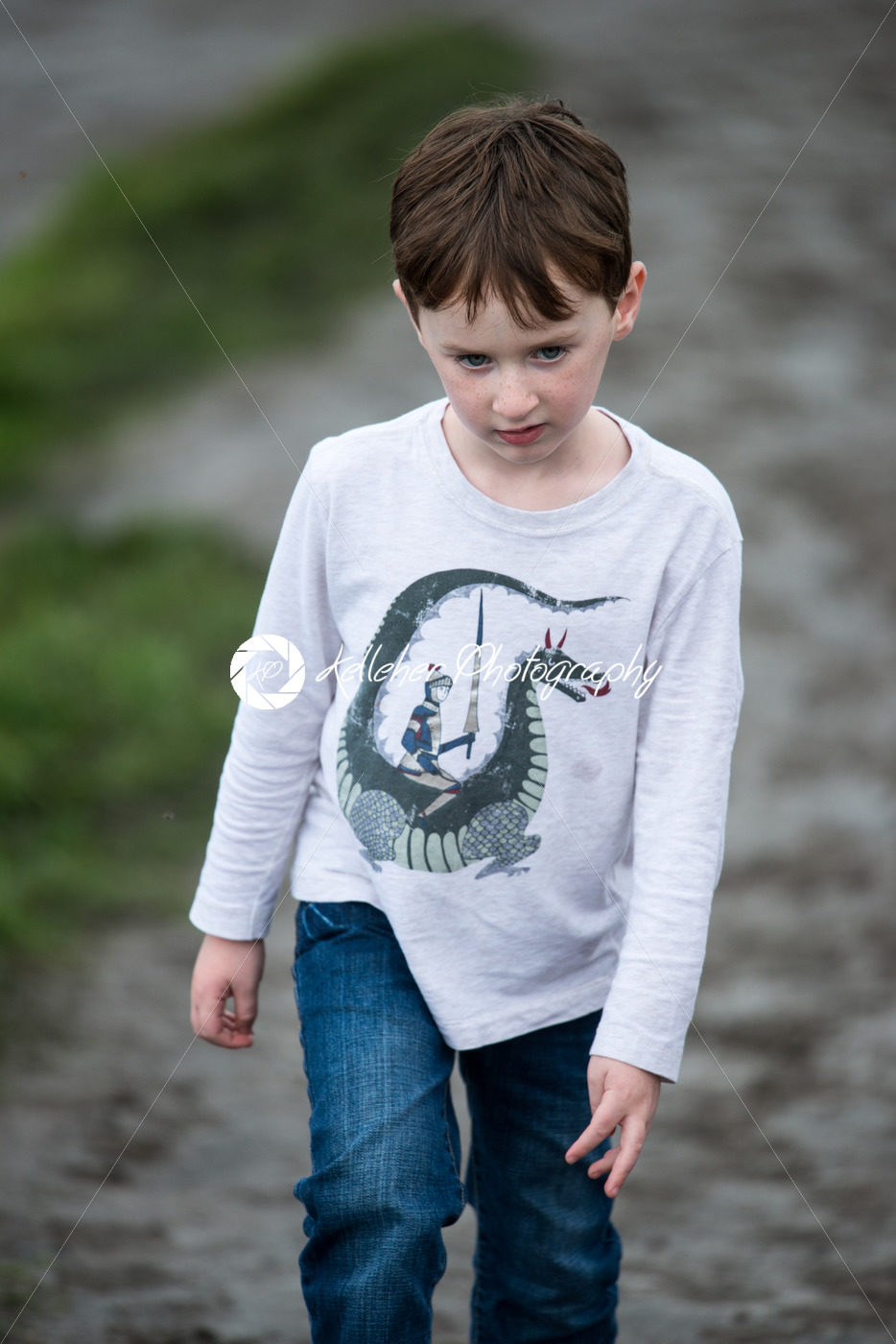 Boy walking up the Cliffs of Moher Tourist Attraction in Ireland - Kelleher Photography Store