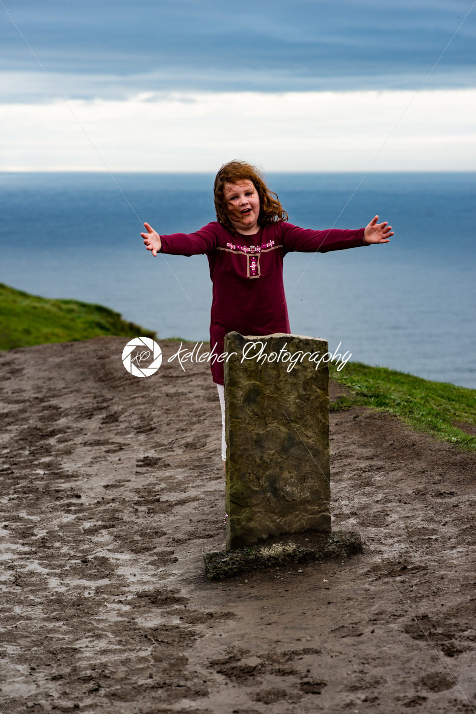 Girl at the Cliffs of Moher Tourist Attraction in Ireland - Kelleher Photography Store