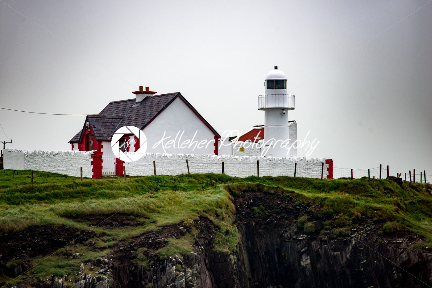 The lighthouse on a cliff in Dingle, Ireland - Kelleher Photography Store