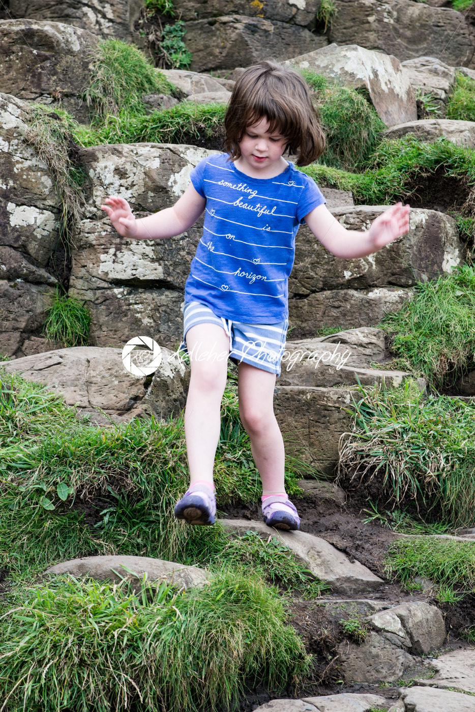 Young Girl walking on the rocks at Giant’s Causeway - Kelleher Photography Store