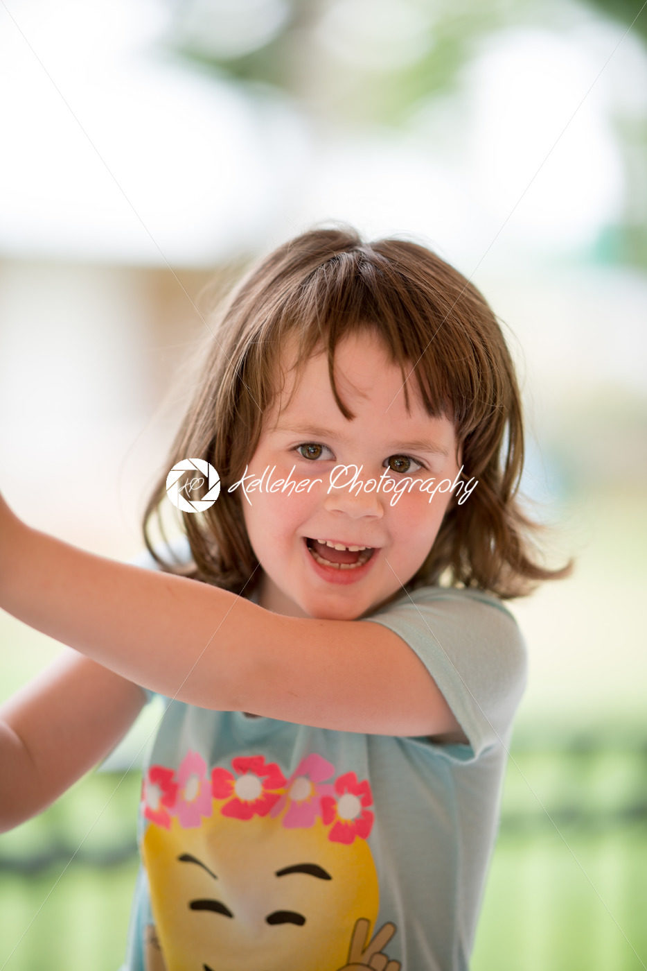 Young girl having fun outside at park on a playground - Kelleher Photography Store