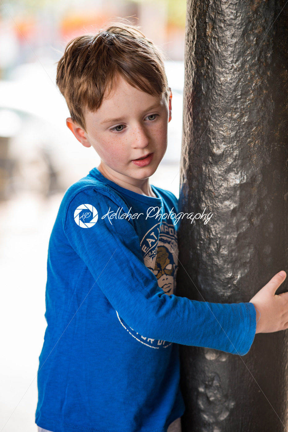 Young little boy portrait looking and smiling at the camera. - Kelleher Photography Store