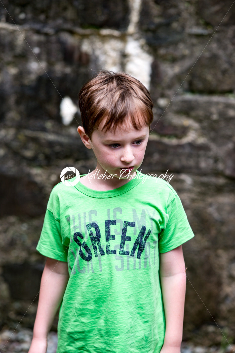 Young little boy portrait looking around inside an old castle - Kelleher Photography Store