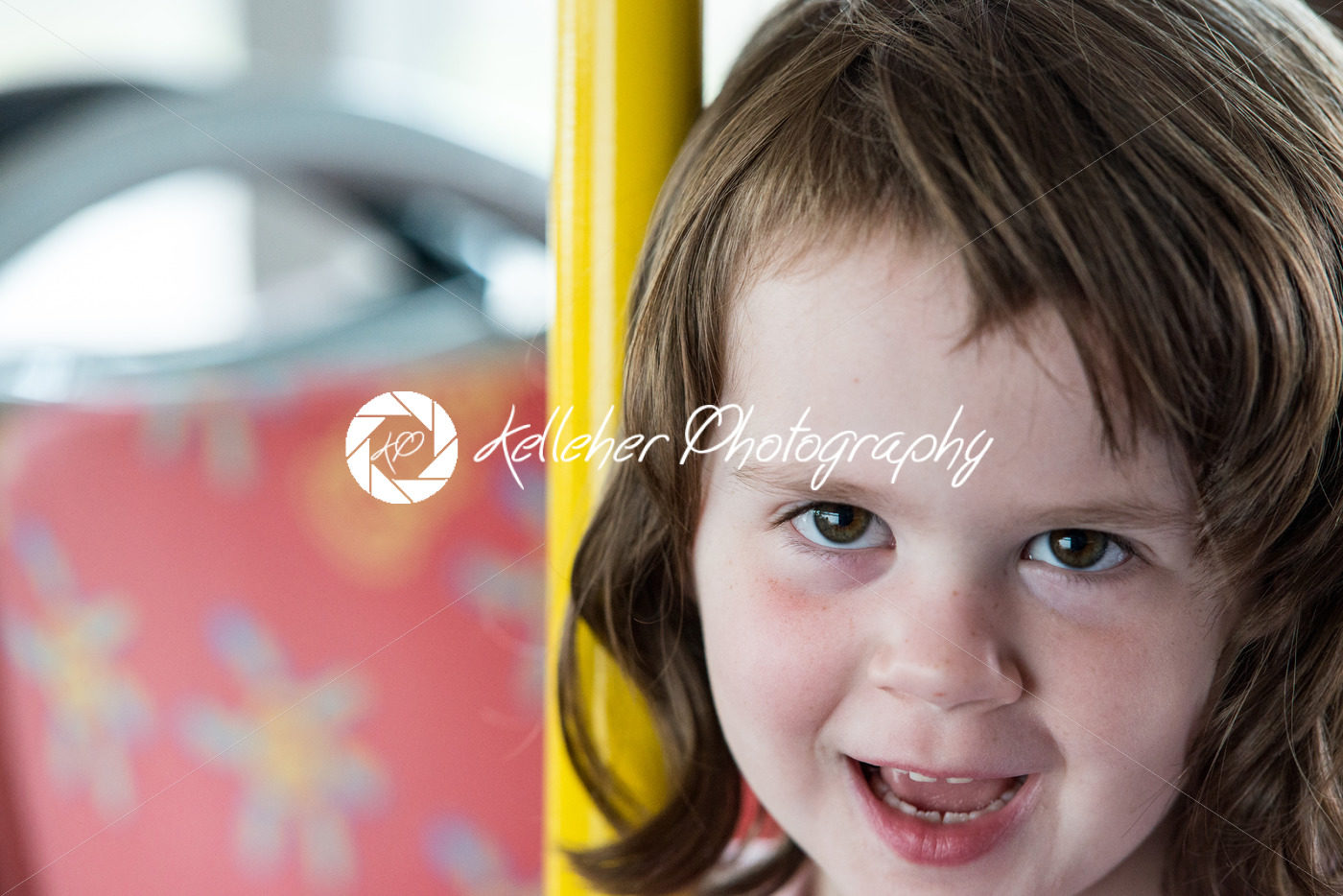Young little girl portrait looking and smiling at the camera. - Kelleher Photography Store