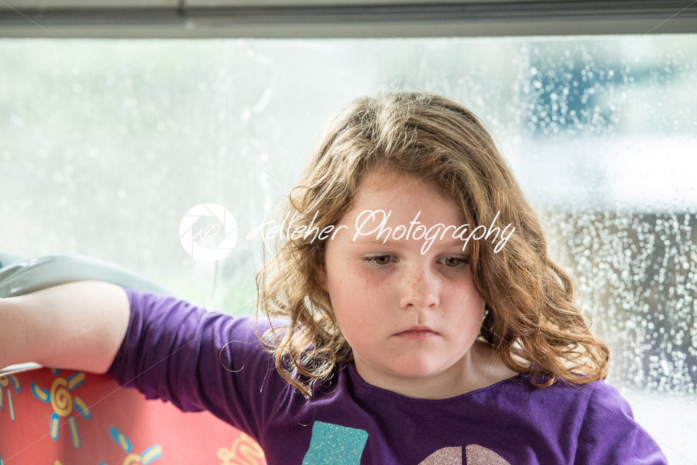Young little girl portrait looking at something - Kelleher Photography Store