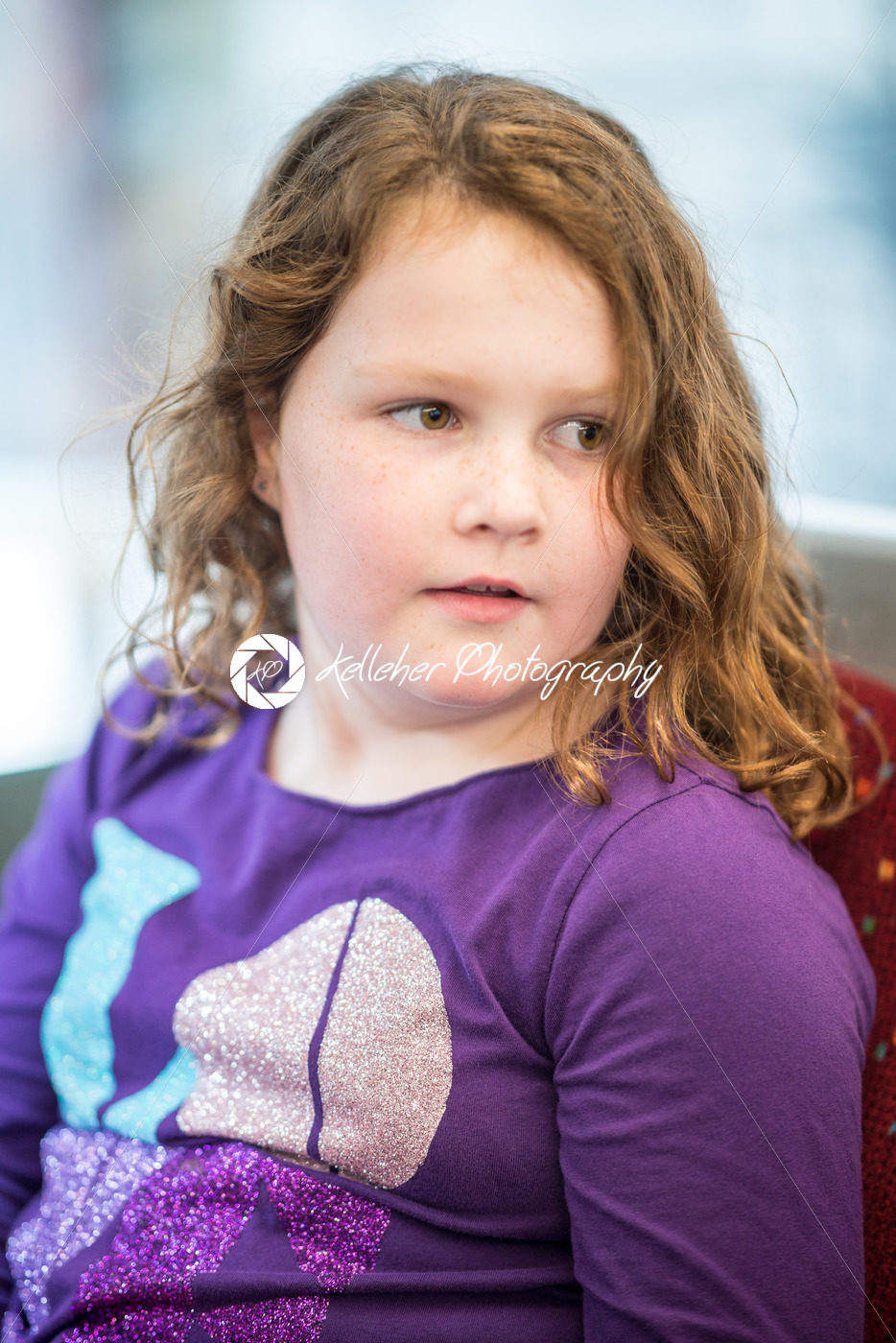 Young little girl portrait looking at somthing - Kelleher Photography Store