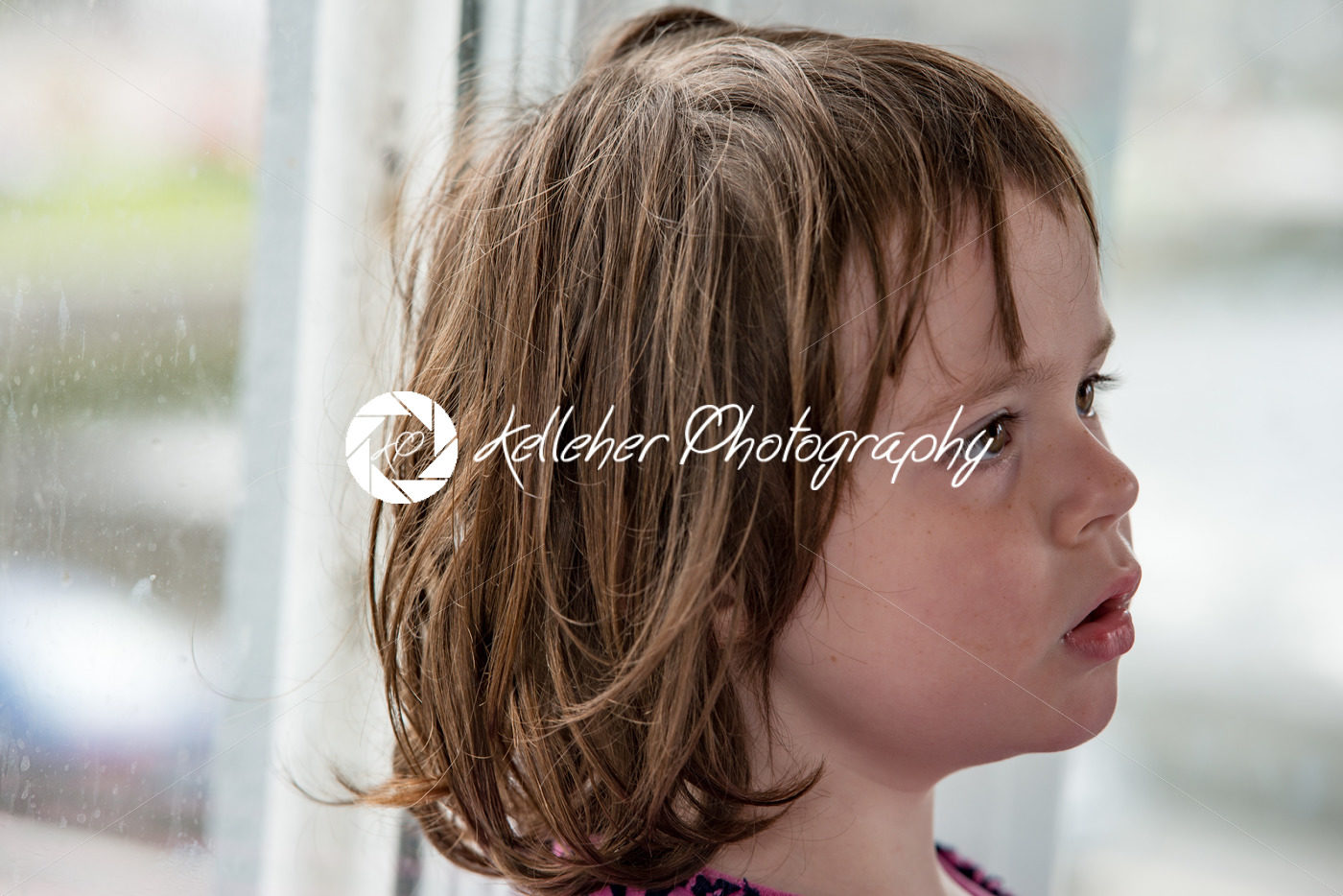 Young little girl portrait looking out window - Kelleher Photography Store