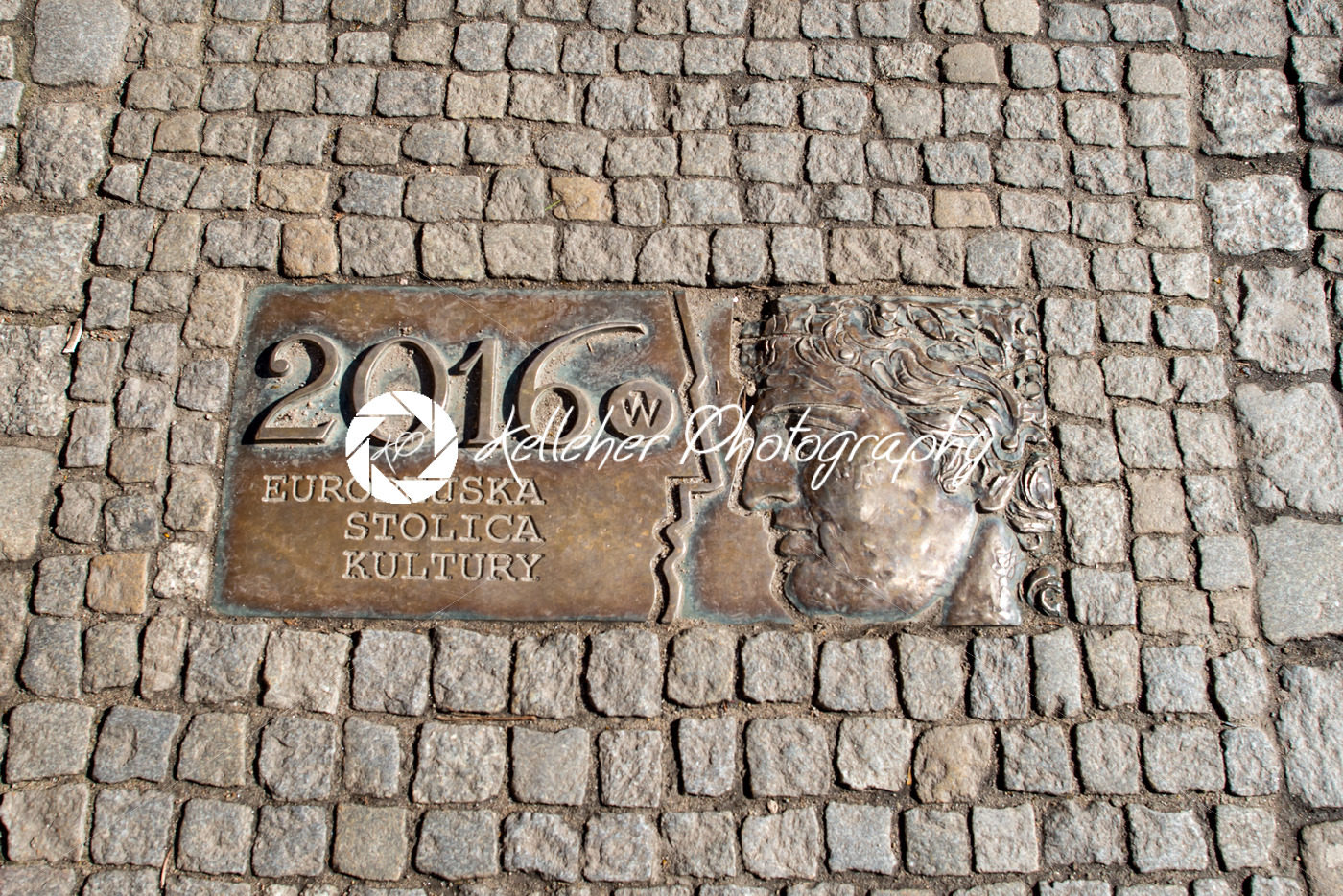 Wroclaw, Poland – March 9, 2018: One of the metal plaques on Wroclaw’s Sidewalk Timeline commemorating influential dates - Kelleher Photography Store