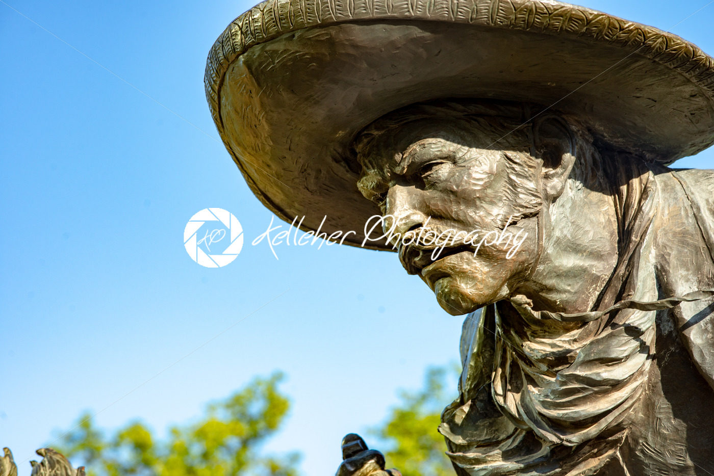 Dallas, Texas – May 7, 2018: Cowboy and longhorn cows with cattle in the background, as part of a landmark bronze cattle sculpture - Kelleher Photography Store