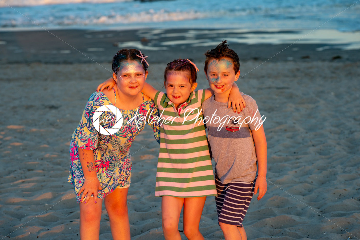Brother and sisters on beach at sunset during the golden hour - Kelleher Photography Store