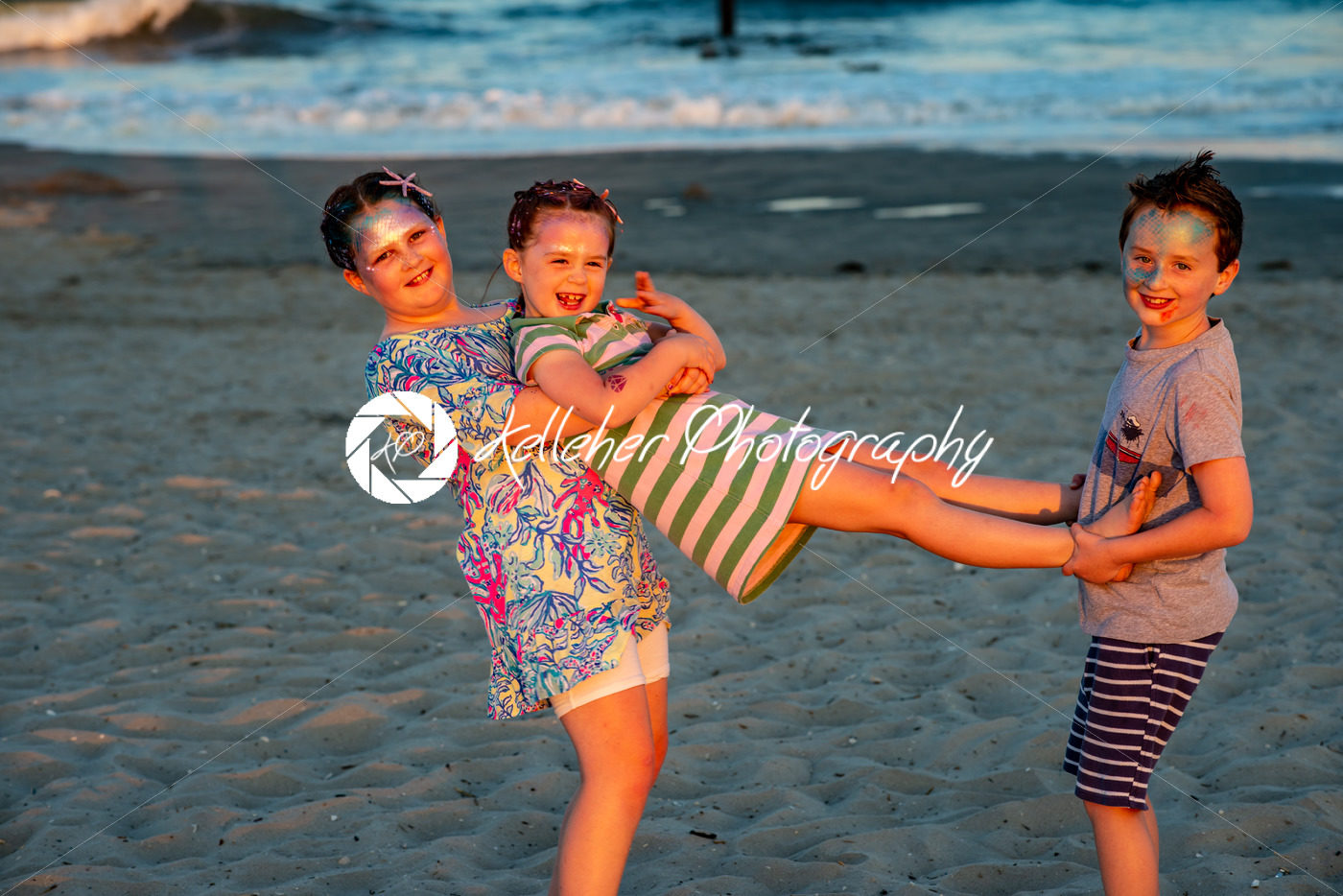 Brother and sisters on beach at sunset during the golden hour - Kelleher Photography Store