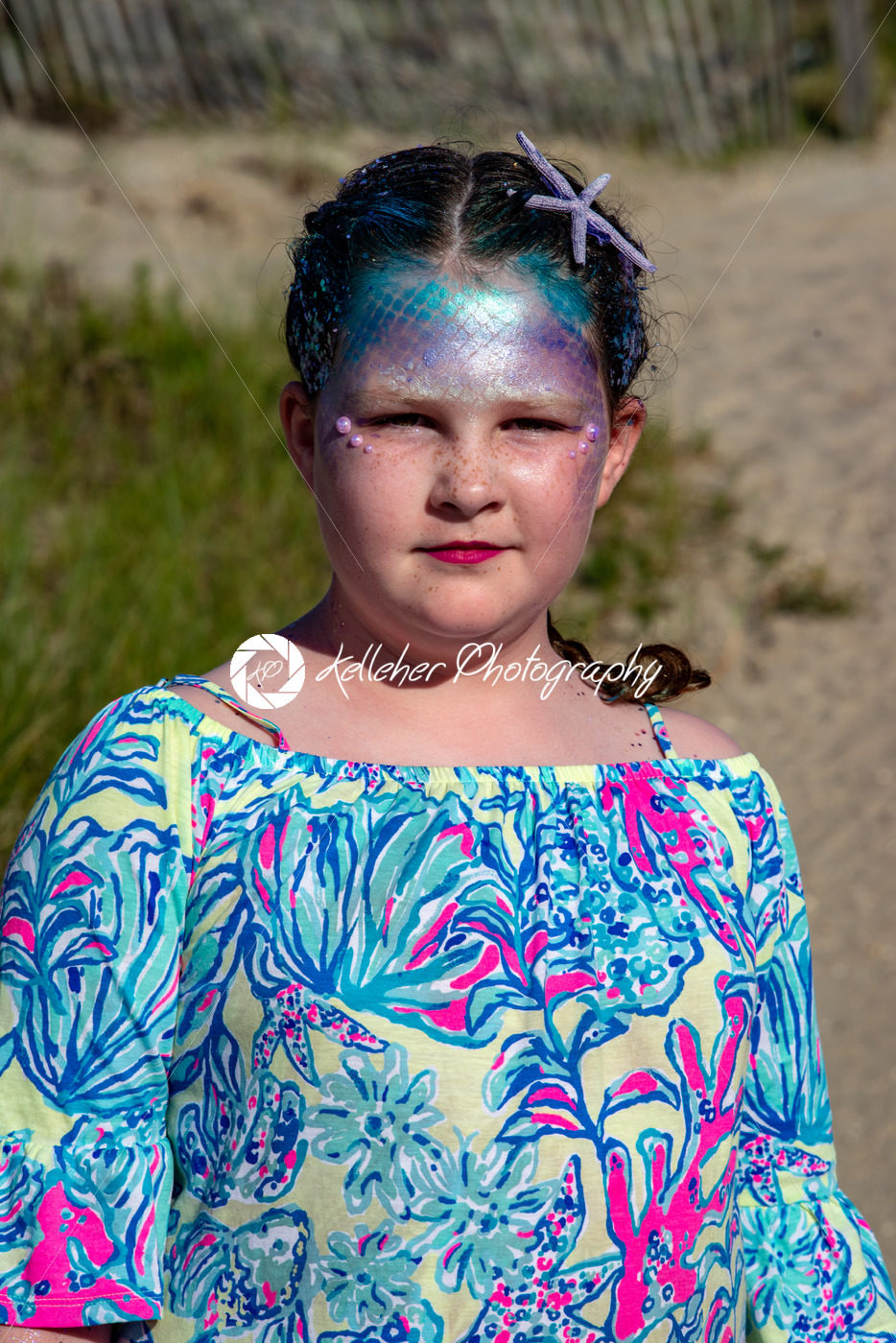 Portrait of a beautiful young mermaid girl playing in the ocean surf at the beach on a sunny day - Kelleher Photography Store