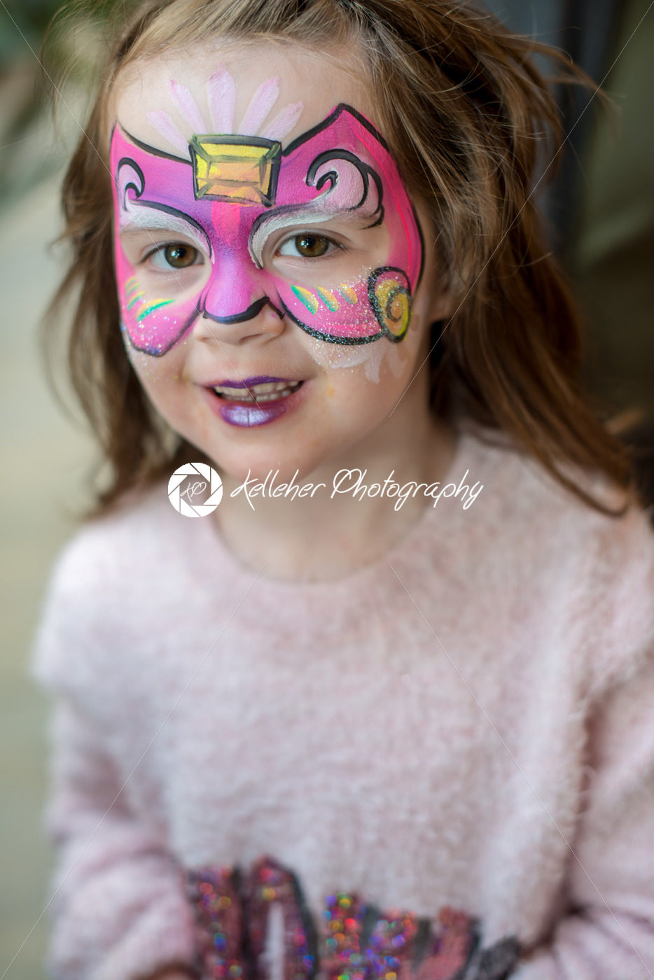 Pretty excited cute young girl with face painting like a butterfly - Kelleher Photography Store