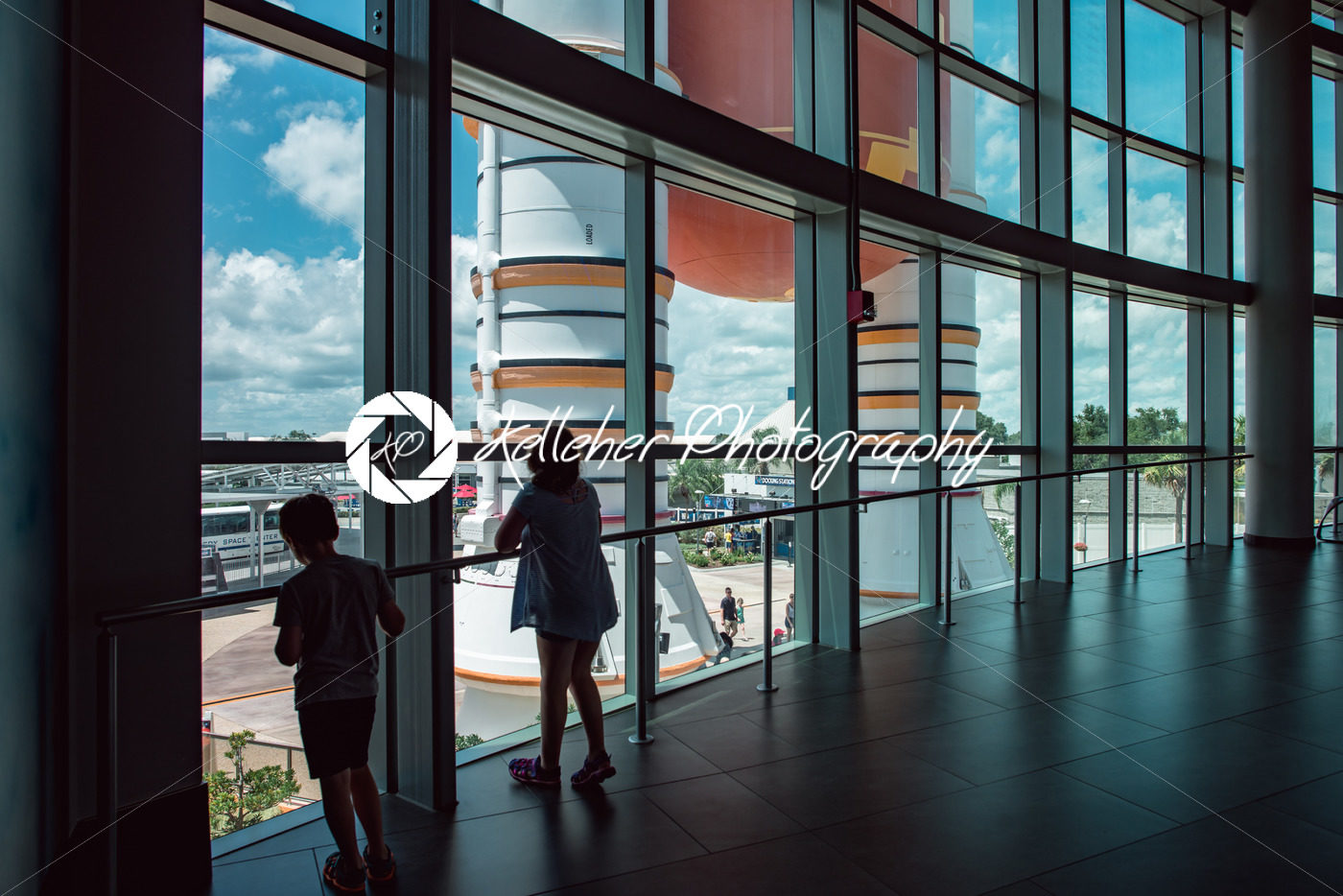 Cape Canaveral, Florida – August 13, 2018: Kids looking out at Atlantis Space Shuttle Rocket Booster at NASA Kennedy Space Center - Kelleher Photography Store