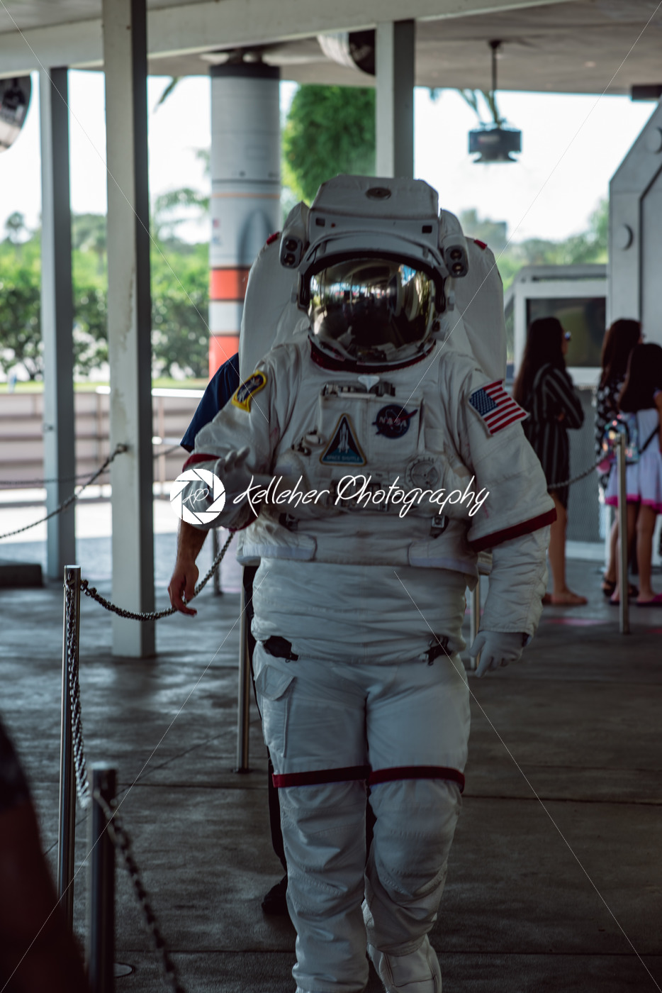 Cape Canaveral, Florida – August 13, 2018: Person in Astronaut space cuit walking by and waving at NASA Kennedy Space Center - Kelleher Photography Store